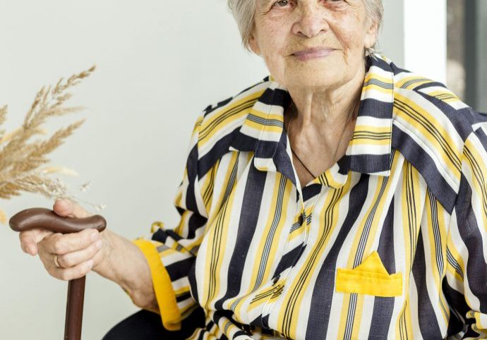 portrait-of-grandmother-posing-in-elegant-dress